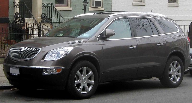 brown buick enclave parked on the street