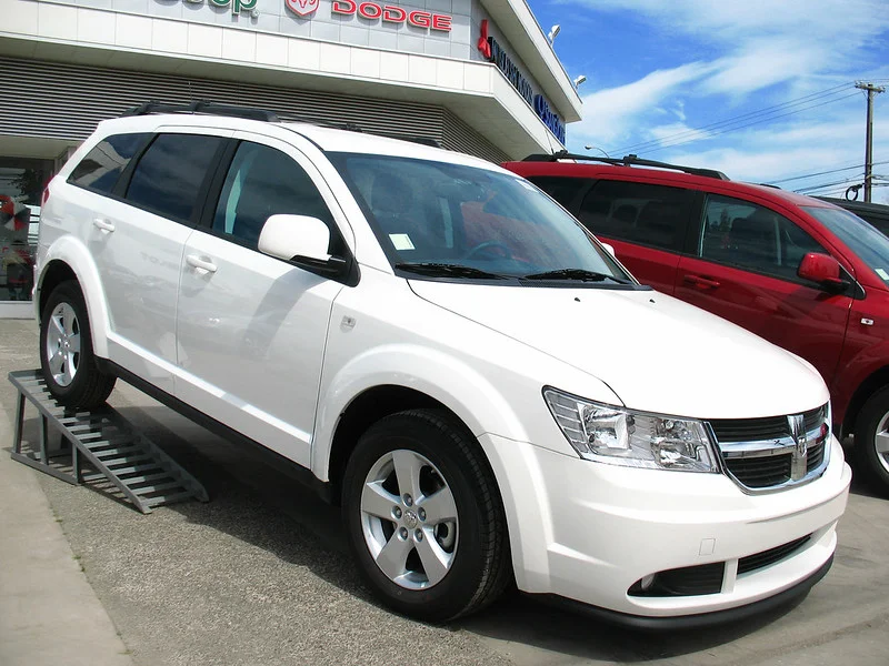 White Dodge Journey in a lot