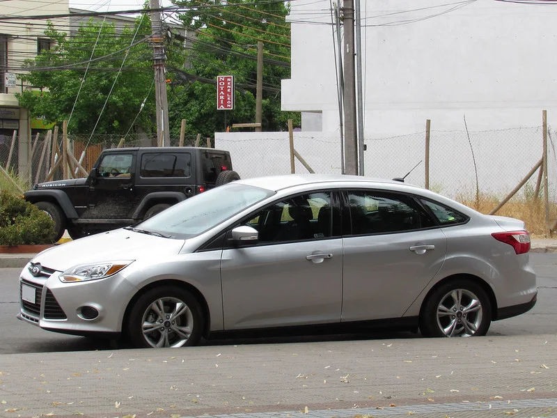 Silver 2014 Ford Focus on a street