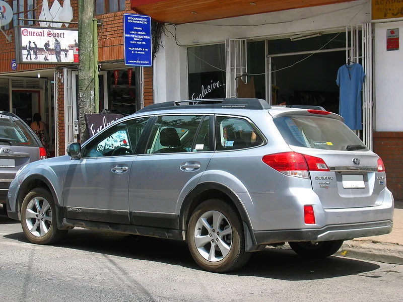 Silver 2014 Subaru Outback on a street
