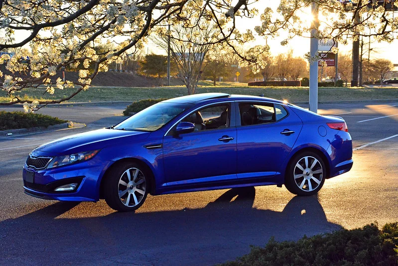 Blue 2015 Kia Optima at sunset