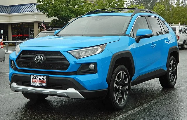 Blue Toyota RAV4 in a parking lot