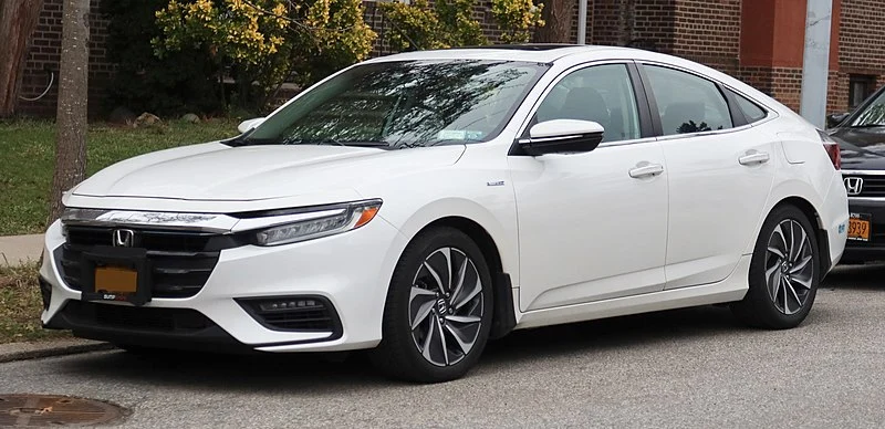 White Honda Insight Touring parked on a street