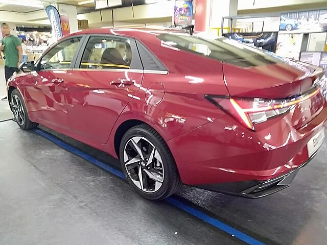 Red 2021 Hyundai Elantra in a showroom