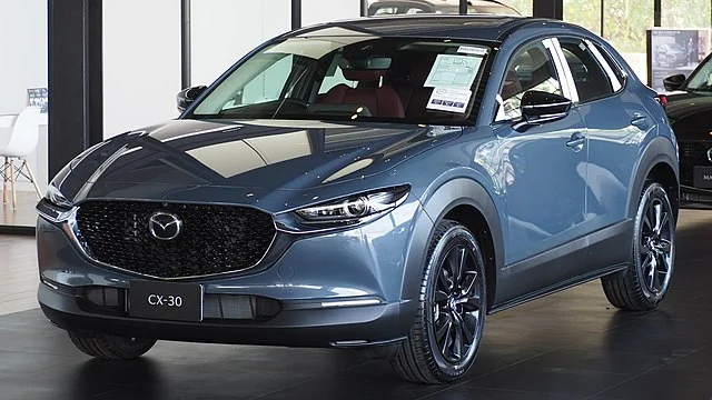 Blue Mazda CX-30 in a showroom