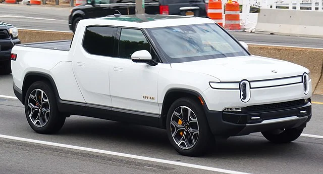 White Rivian R1T in a parking lot