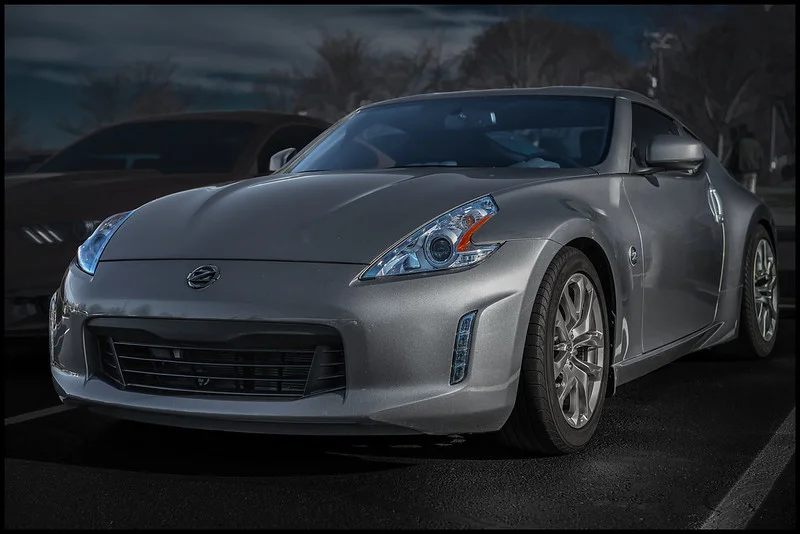 Nissan in a parking lot at night