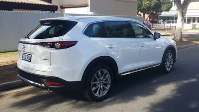 White Mazda CX-9 parked on a street