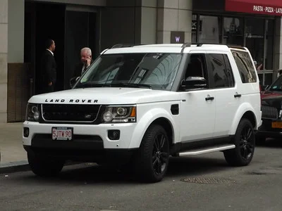 White Land Rover LR4 parked on a street