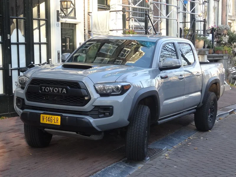 Toyota Tacoma parked on a cobblesotne street