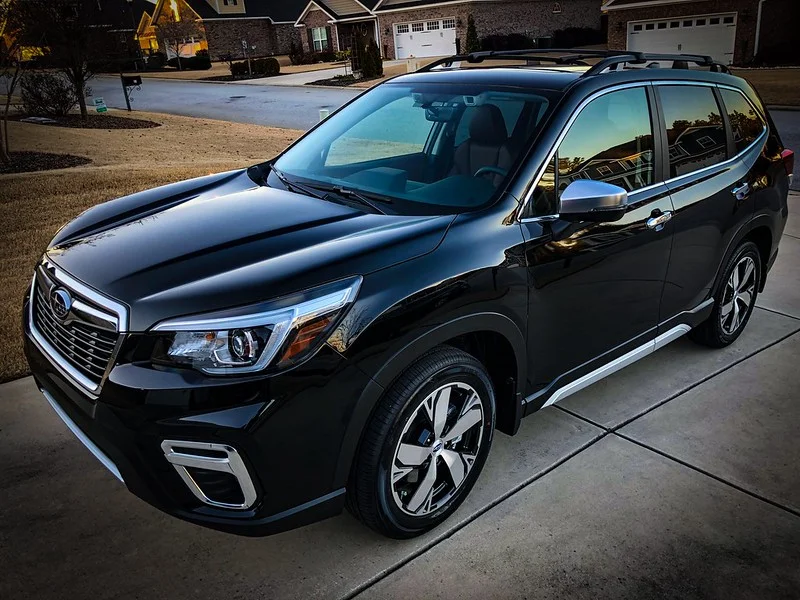 Black Subaru Forester in a driveway