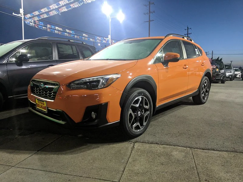 Orange Subaru Crosstrek in a car lot