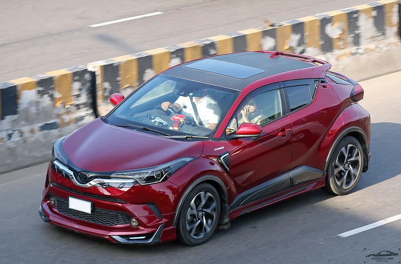 Red Toyota C-HR on a road