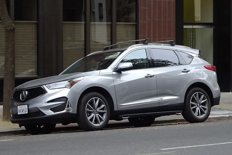 Silver Acura RDX parked on a street