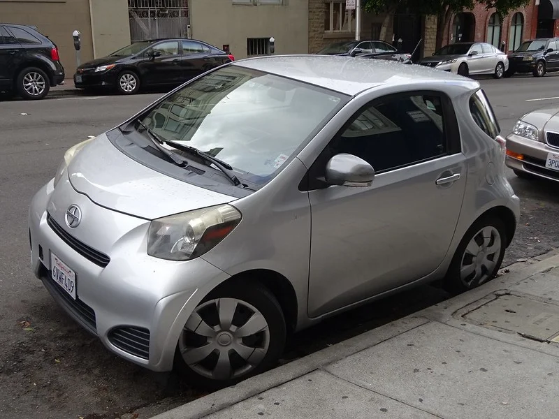 Silver Scion iQ on a street