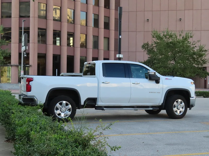 White Chevy Silverado parked in a lot