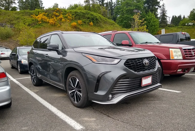 Grey Toyota Highlander in a parking lot