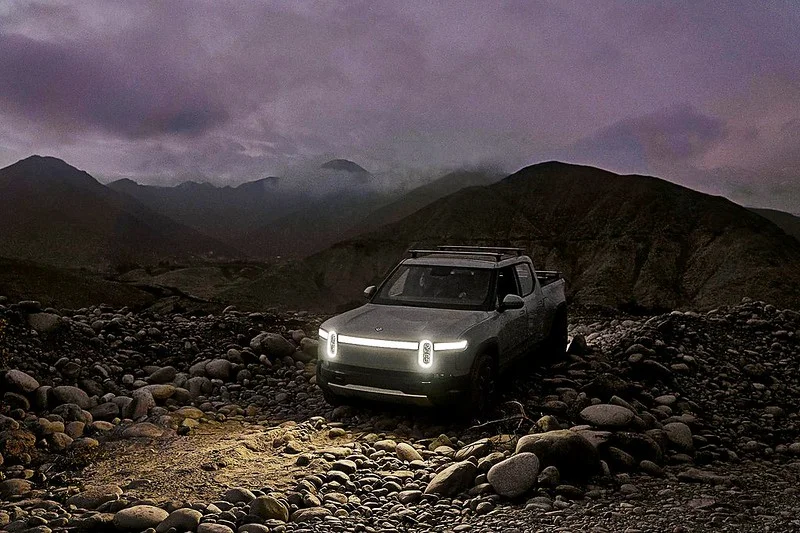 Rivian R1T at night in the mountains