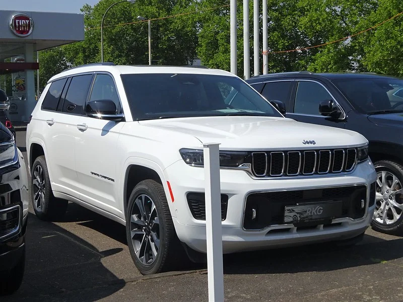 White 2022 Jeep Grand Cherokee in a parking lot