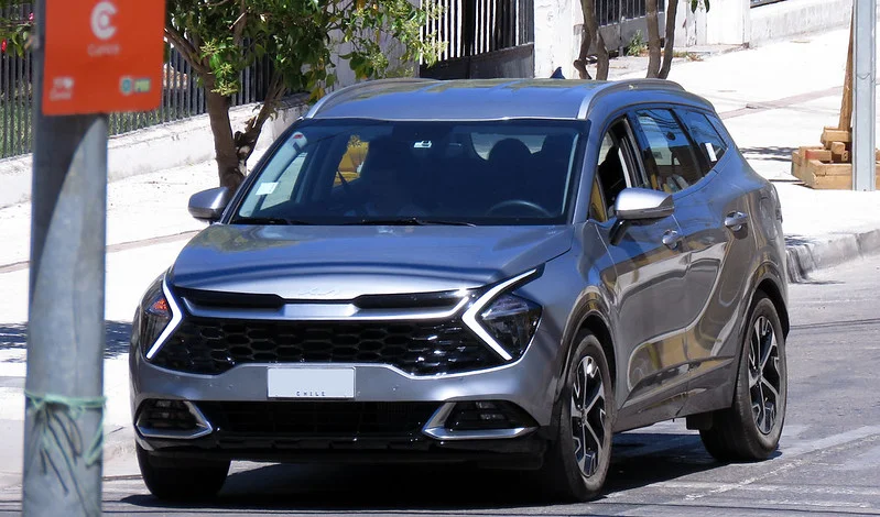 Silver 2023 Kia Sportage on a street