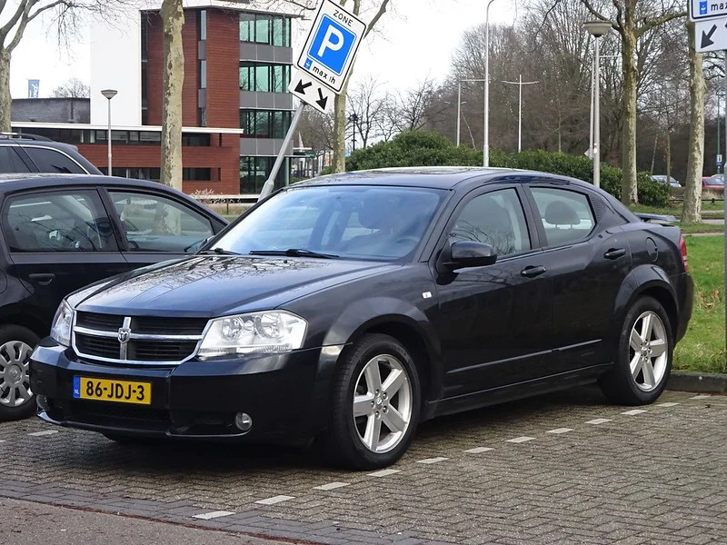 Black Dodge Avenger parked outdoors