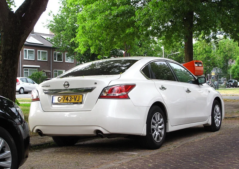 Rear view of a white 2015 Nissan Altima