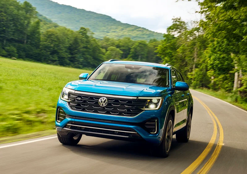 Volkswagen Atlas driving down a country road