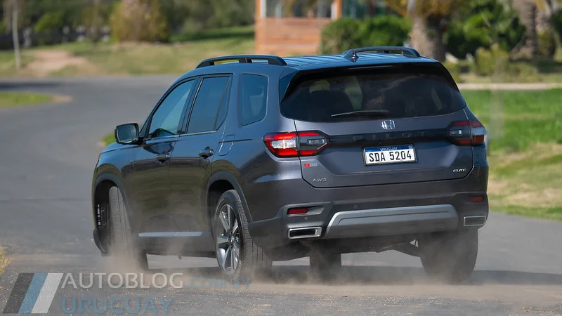 2023 Honda Pilot driving on a road