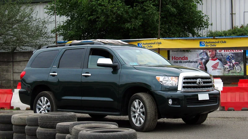 Black Toyota Sequoia driving outside