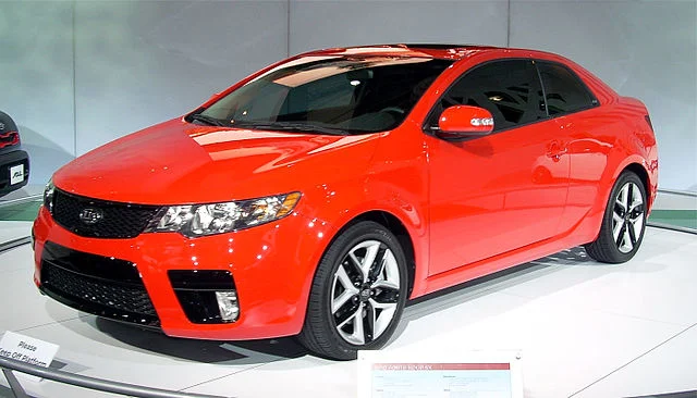 Red Kia Forte Koup in a showroom