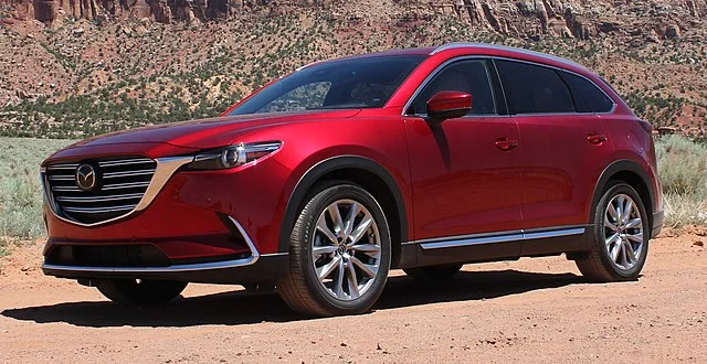 Red Mazda CX-9 parked in the desert