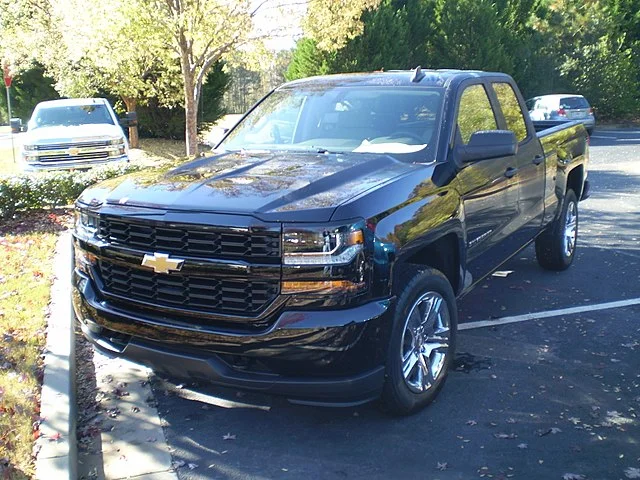 Black Chevy Silverado in a parking lot