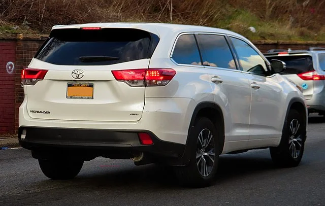Rear view of a white 2018 Toyota Highlander 