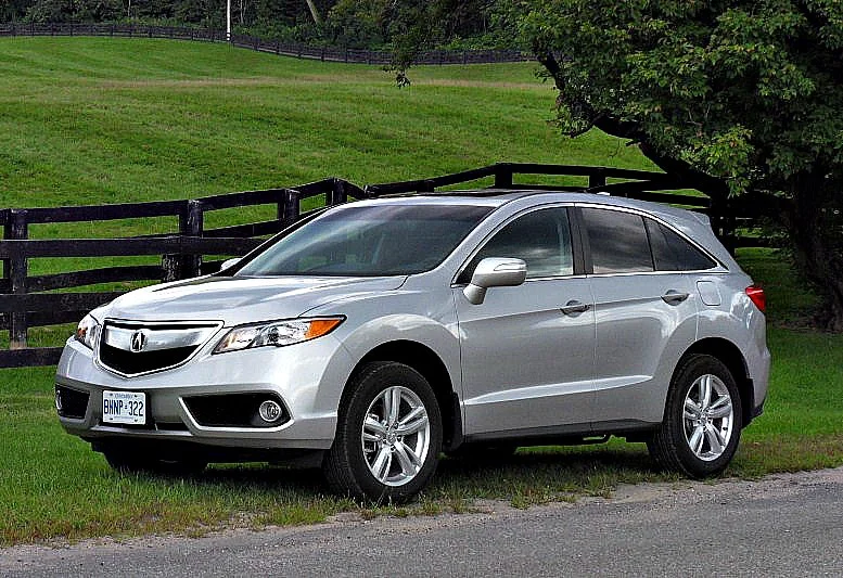 Acura RDX parked near a field