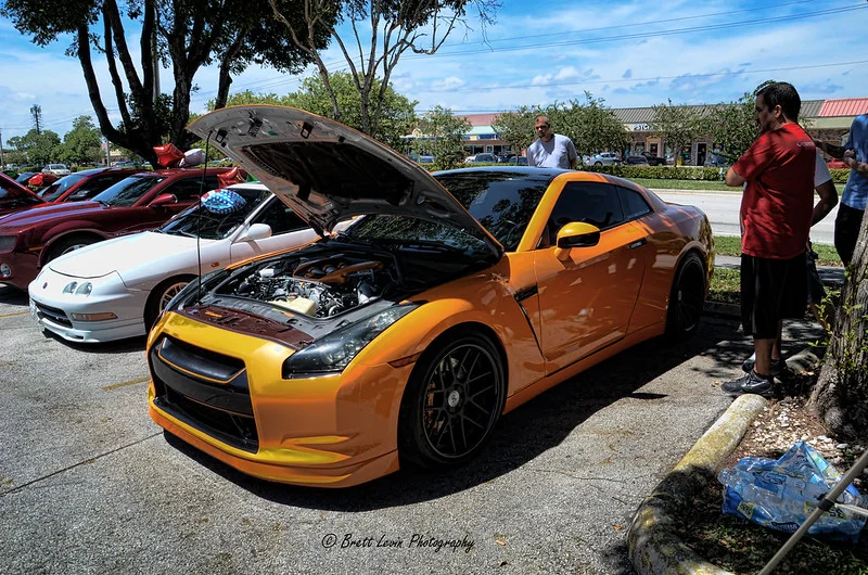 Nissan GT-R with its hood open in a parking lot