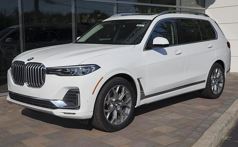 White BMW X7 in a lot