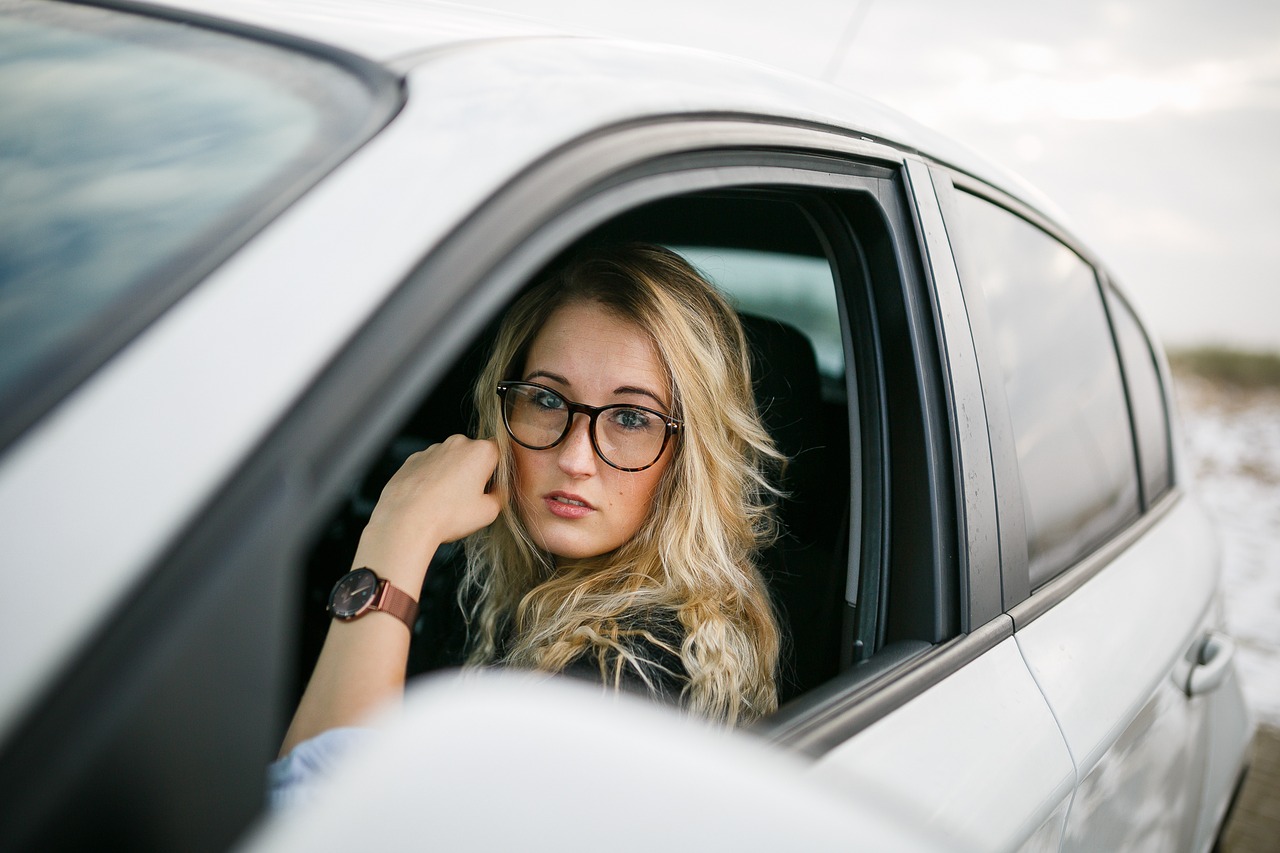 Photo of college student driving a car