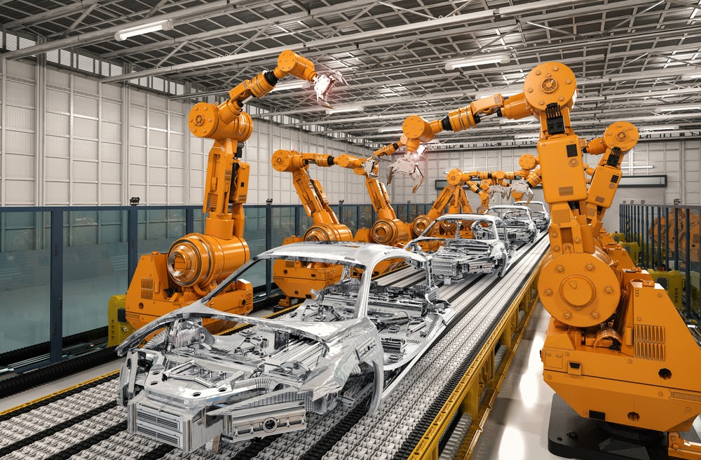 Photo of automotive robots assembling car frames. 