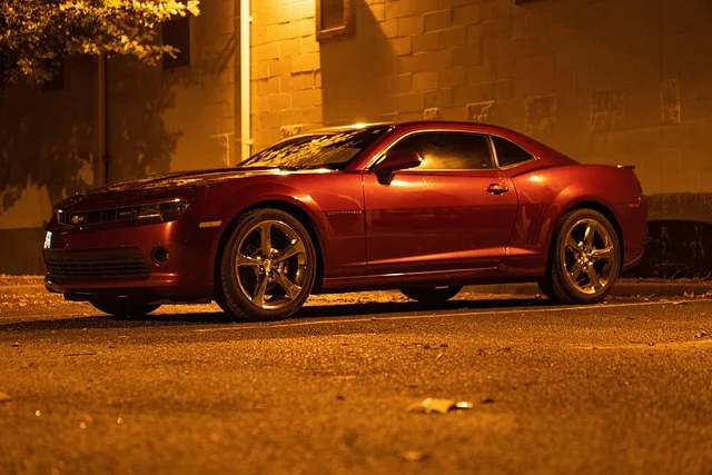 Chevy Camaro in a parking lot at night