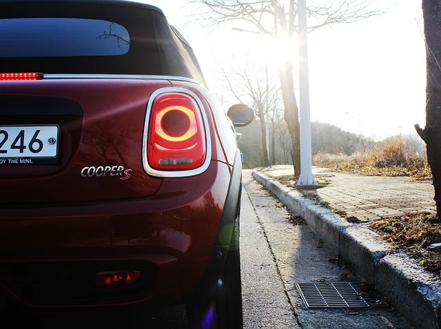 MINI Cooper Convertible on a road at sunset