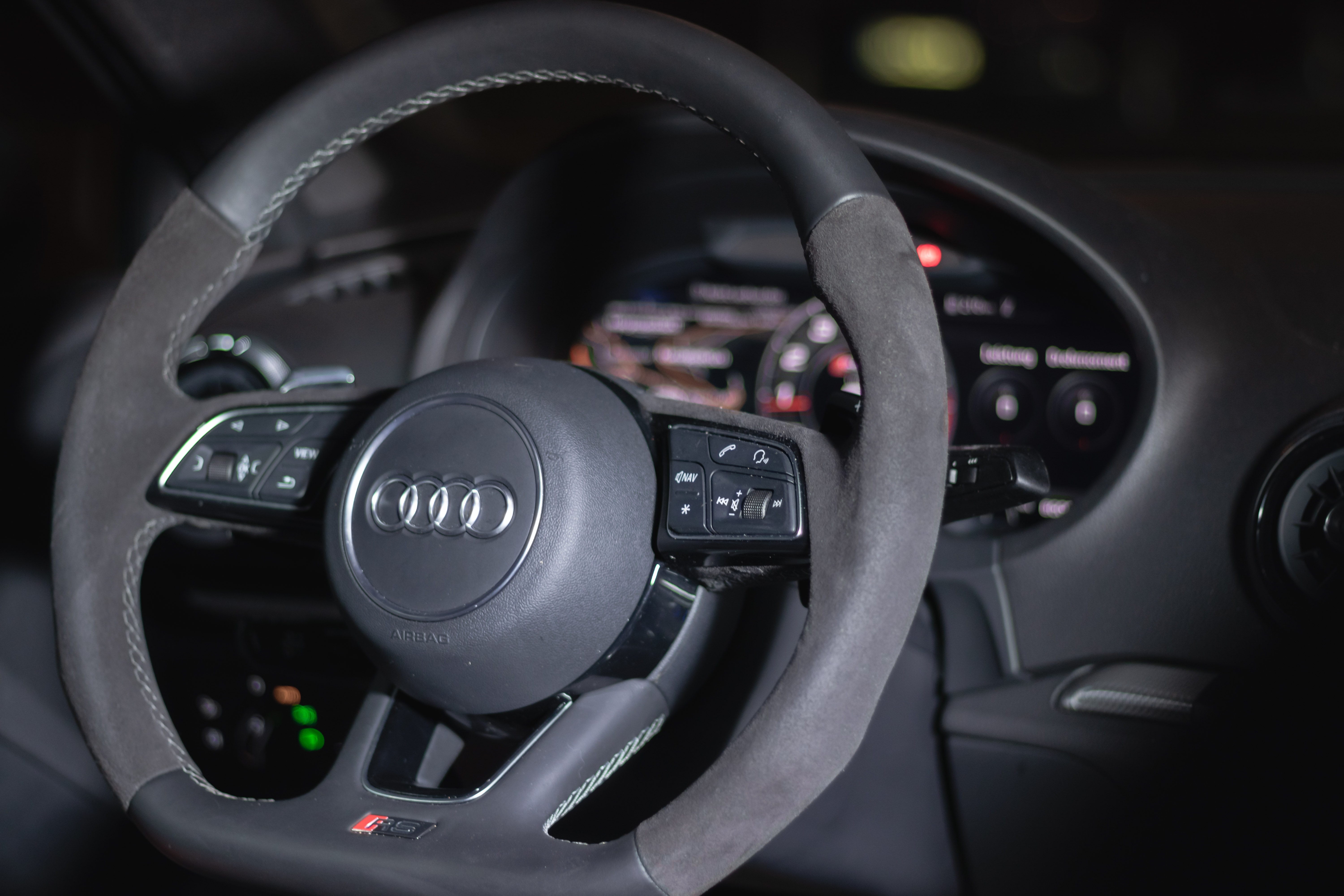 dashboard and steering wheel of an audi car