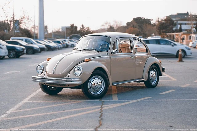 Tan Volkswagen Beetle in a parking lot