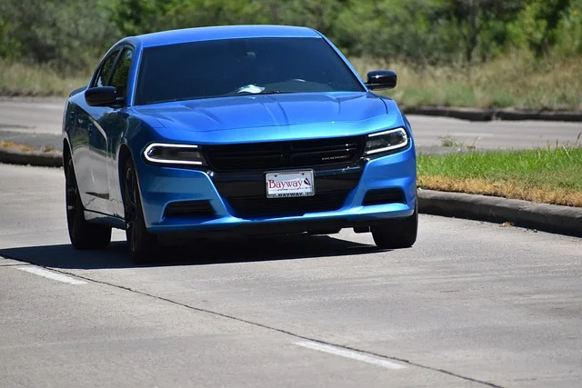 Blue Dodge Charger on a racetrack