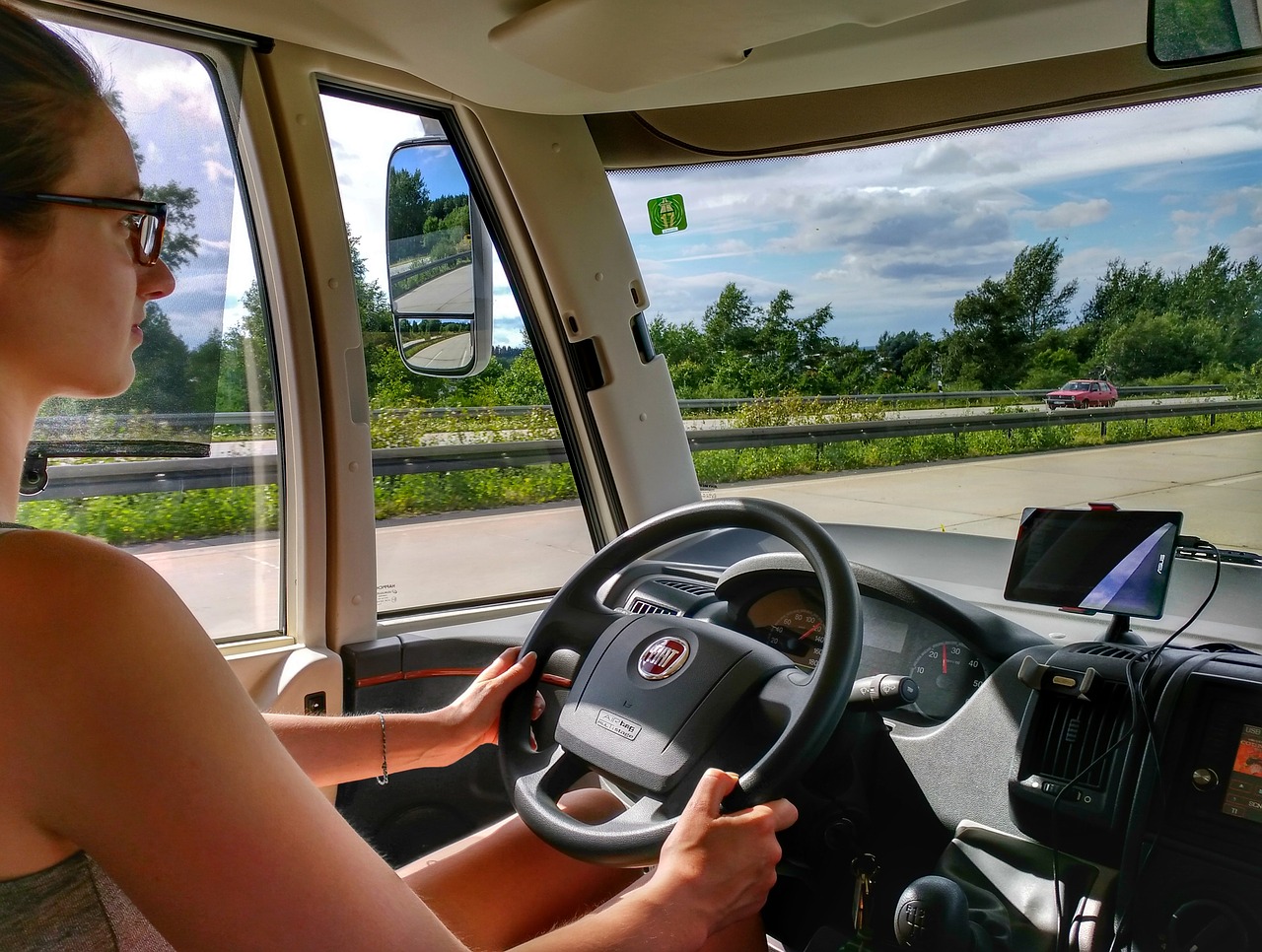 Photo of woman driving an SUV