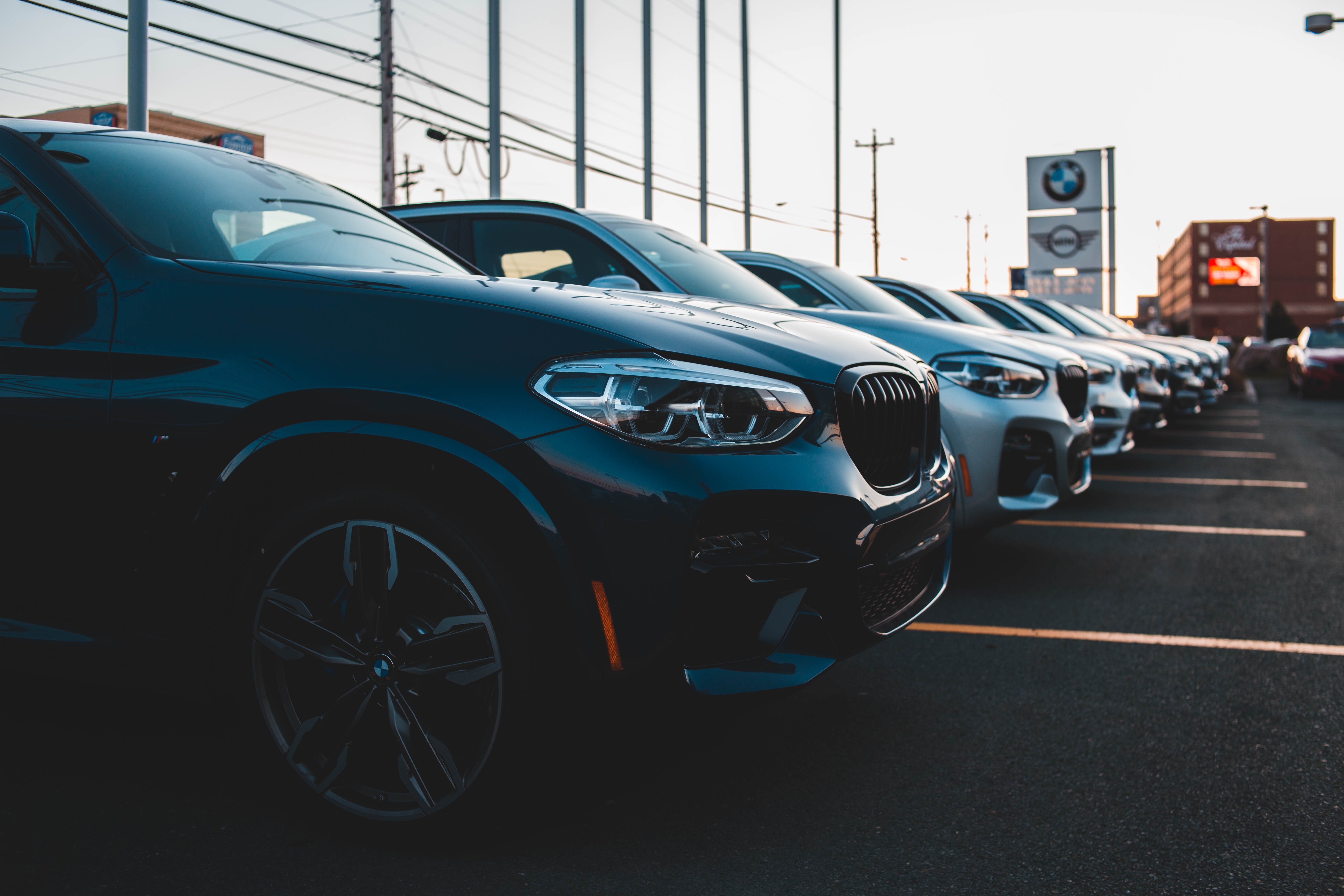 cars sitting on dealership lot