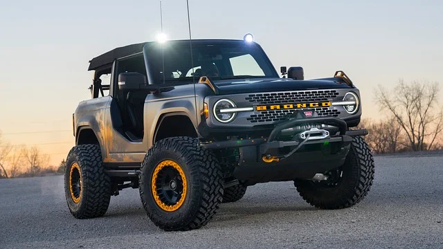 Ford Bronco parked in the desert at sunset