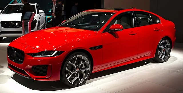 Red Jaguar XE in a showroom