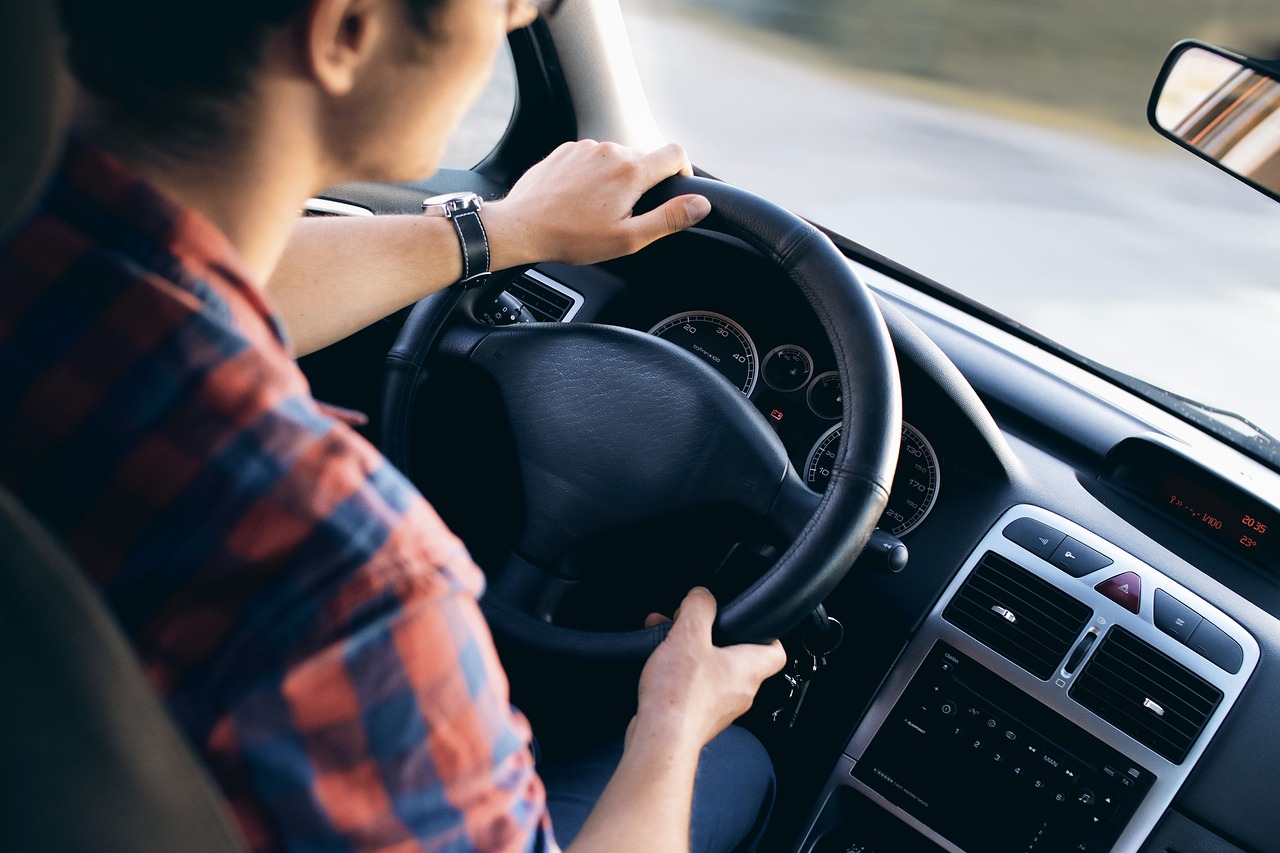 Photo of man driving car