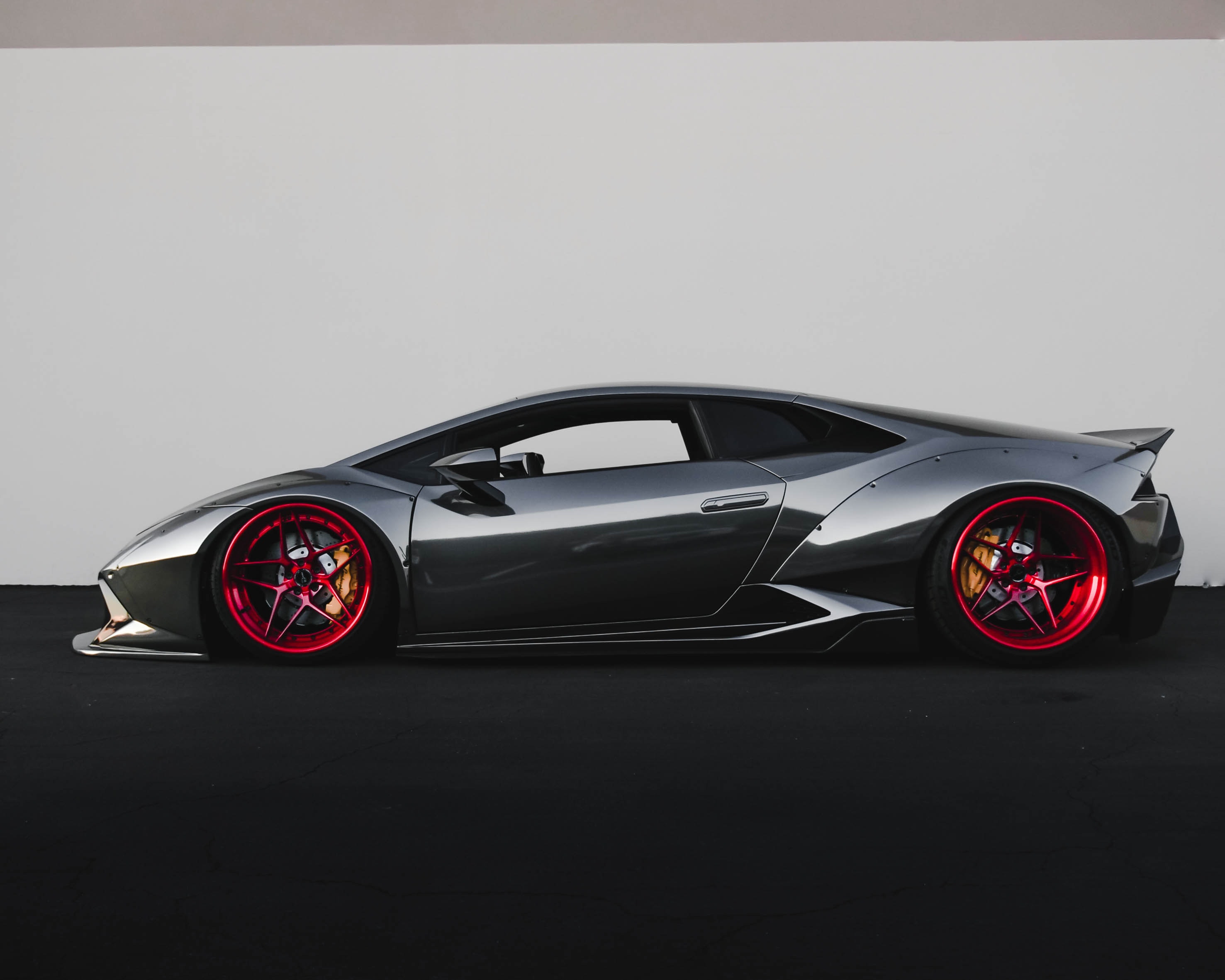 shiny sports car with red rims