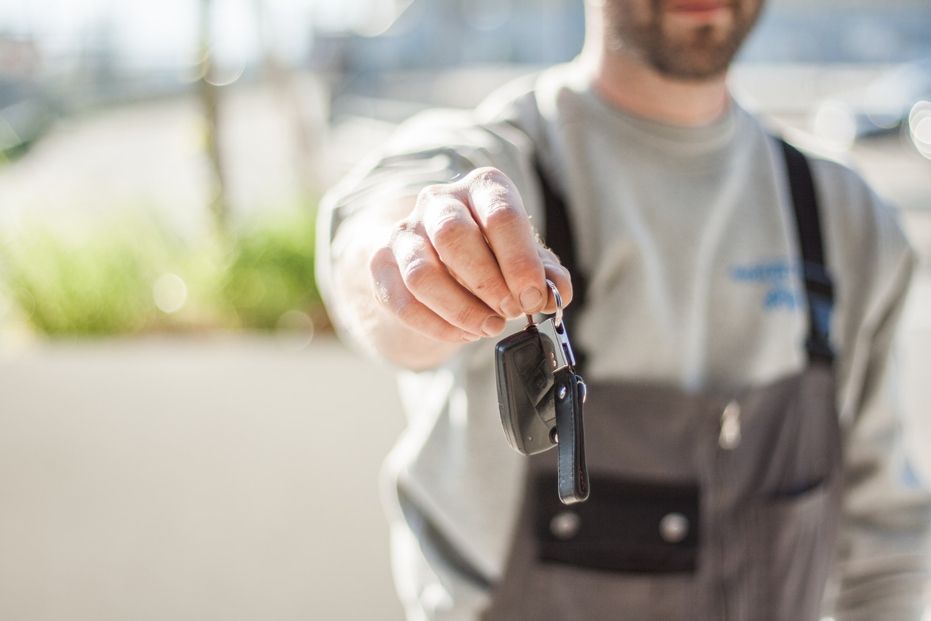 Photo of man holding car keys